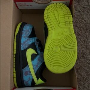 Nike Black and Blue Sneakers with Bold Design